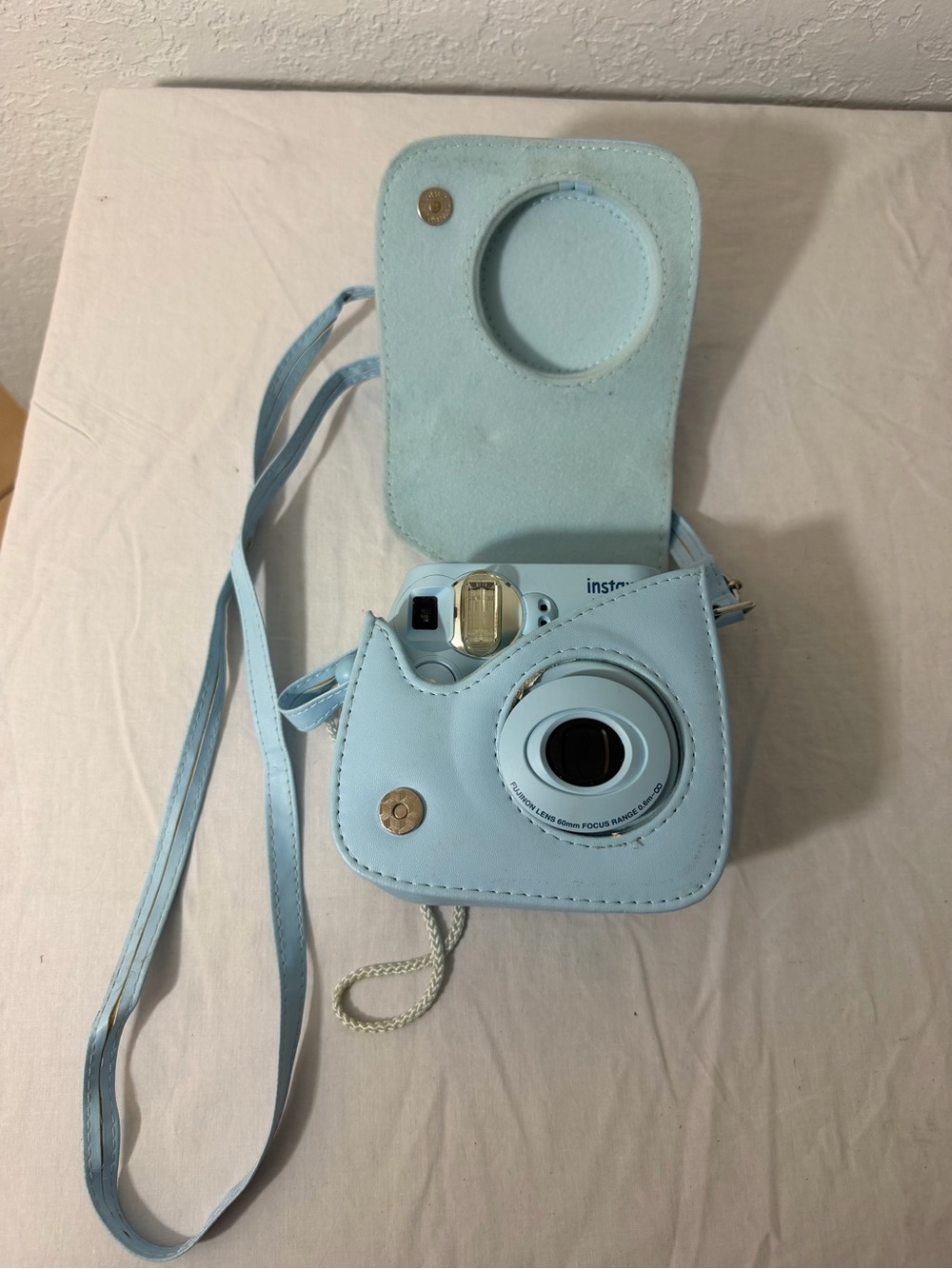 Instax Light Blue Instant Camera with Matching Light Blue Case and Strap